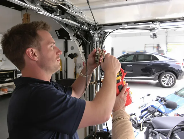 Bellflower Garage Door Repair safety certified technician performing cable replacement in Bellflower