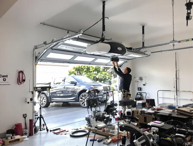 Bellflower Garage Door Repair specialist installing smart garage door opener system in Bellflower home