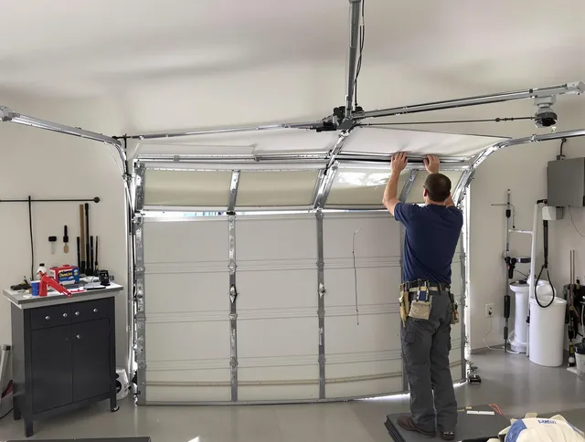 Bellflower Garage Door Repair specialist performing precise section replacement on Bellflower garage door